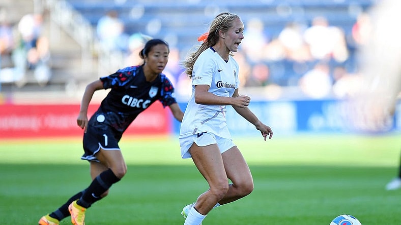 Jul 10, 2022; Bridgeview, Illinois, USA; North Carolina Courage forward Brittany Ratcliffe (27) moves the ball ahead of Chicago Red Stars forward Yuki Nagasato (7) during the first half at SeatGeek Stadium. Mandatory Credit: Daniel Bartel-USA TODAY Sports