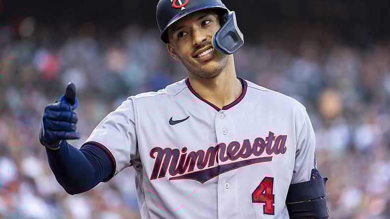 Jul 23, 2022; Detroit, Michigan, USA; Minnesota Twins shortstop Carlos Correa (4) smiles and gives a fan a thumbs up during the seventh inning in a game against the Detroit Tigers at Comerica Park. Mandatory Credit: Raj Mehta-USA TODAY Sports
