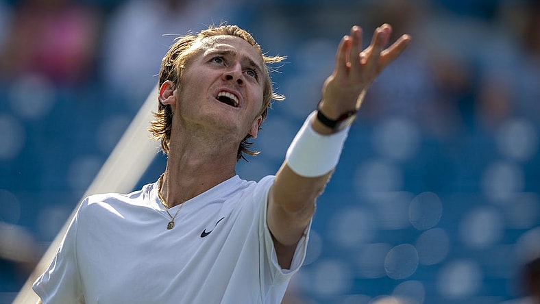 Aug 18, 2022; Cincinnati, OH, USA; Sebastian Korda (USA) tosses the ball to serve during his match against John Isner (USA) at the Western & Southern Open at the at the Lindner Family Tennis Center. Mandatory Credit: Susan Mullane-USA TODAY Sports