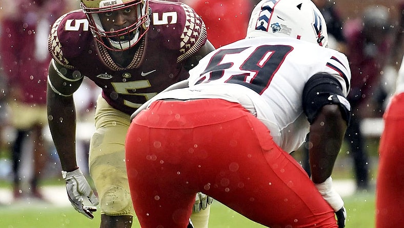Aug 27, 2022; Tallahassee, Florida, USA; Florida State Seminoles defensive end Jared Verse (5) lines up against  Duquesne Dukes offensive lineman Chris Oliver (59) during the first half at Doak S. Campbell Stadium. Mandatory Credit: Melina Myers-USA TODAY Sports