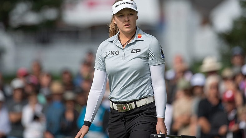 Aug 27, 2022; Ottawa, Ontario, CAN; Brooke Henderson from Canada follows the ball after a putt on the green of the 1st hole during the third round of the CP Women's Open golf tournament. Mandatory Credit: Marc DesRosiers-USA TODAY Sports