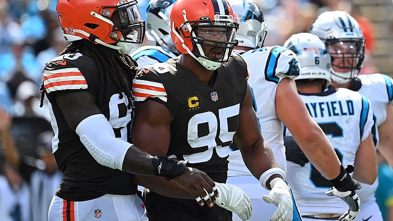 Sep 11, 2022; Charlotte, North Carolina, USA; Cleveland Browns defensive end Myles Garrett (95) reacts with defensive end Jadeveon Clowney (90) after sacking Carolina Panthers quarterback Baker Mayfield (6) in the third quarter at Bank of America Stadium. Mandatory Credit: Bob Donnan-USA TODAY Sports