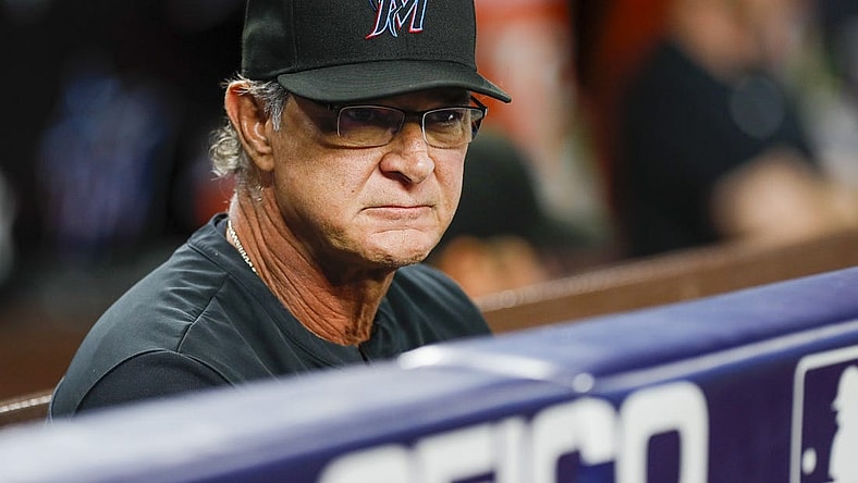 Sep 19, 2022; Miami, Florida, USA; Miami Marlins manager Don Mattingly (8) watches from the dugout during the first inning against the Chicago Cubs at loanDepot Park. Mandatory Credit: Sam Navarro-USA TODAY Sports