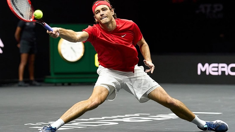Sep 24, 2022; London, United Kingdom;Taylor Fritz (USA) plays a shot against Cameron Norrie (GBR) in a Laver Cup singles match.  Mandatory Credit: Peter van den Berg-USA TODAY Sports