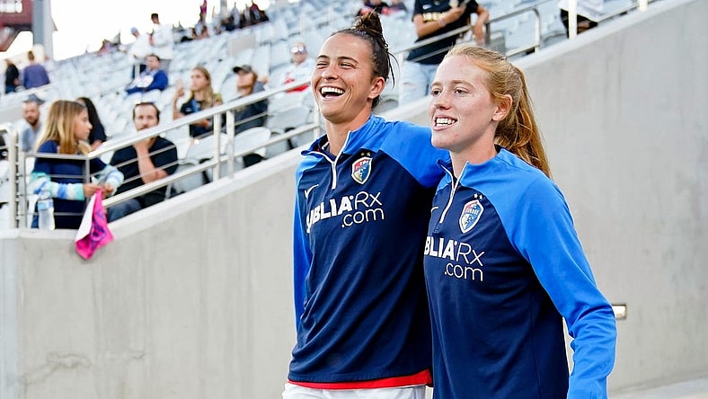 Sep 30, 2022; San Diego, California, USA; North Carolina Courage defender Carson Pickett (left) and midfielder Tess Boade (right) walk to the field before the game against the San Diego Wave FC at Snapdragon Stadium. Mandatory Credit: Ray Acevedo-USA TODAY Sports