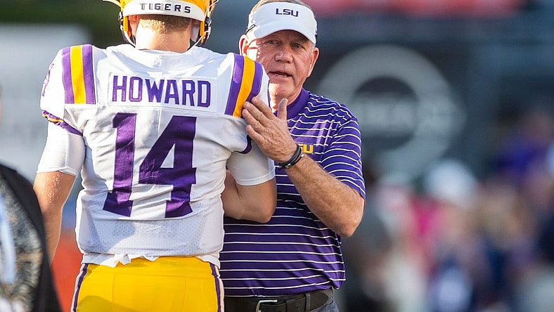 LSU Tigers head coach Brian Kelly talks with LSU Tigers quarterback Walker Howard (14) during warm ups before Auburn Tigers take on LSU Tigers at Jordan-Hare Stadium in Auburn, Ala., on Saturday, Oct. 1, 2022.