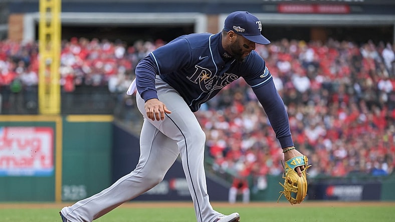 Oct 8, 2022; Cleveland, Ohio, USA; Tampa Bay Rays third baseman Yandy Diaz (2) makes the play against the Cleveland Guardians in the first inning during game two of the Wild Card series for the 2022 MLB Playoffs at Progressive Field. Mandatory Credit: Ken Blaze-USA TODAY Sports