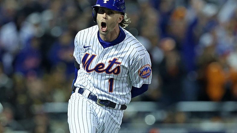 Oct 8, 2022; New York City, New York, USA; New York Mets second baseman Jeff McNeil (1) reacts after hitting a two run double against the San Diego Padres in the seventh inning during game two of the Wild Card series for the 2022 MLB Playoffs at Citi Field. Mandatory Credit: Brad Penner-USA TODAY Sports