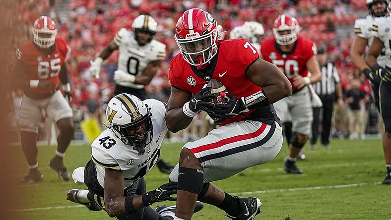 Oct 15, 2022; Athens, Georgia, USA; Georgia Bulldogs tight end Arik Gilbert (7) catches a touchdown pass behind Vanderbilt Commodores linebacker De'Rickey Wright (43) during the second half at Sanford Stadium. Mandatory Credit: Dale Zanine-USA TODAY Sports
