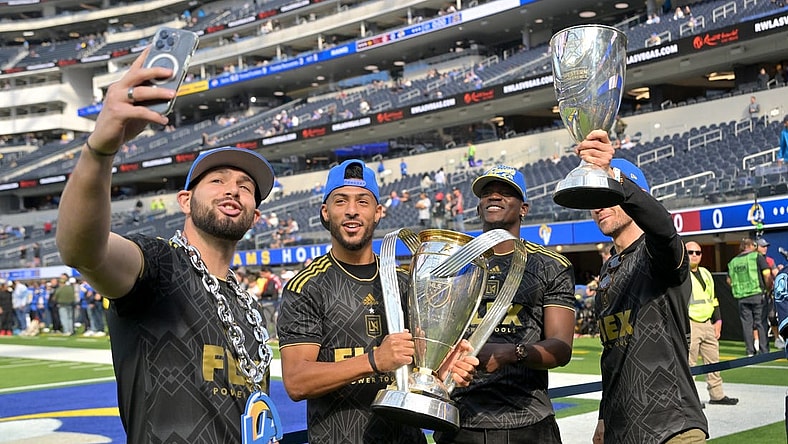 Nov 13, 2022; Inglewood, California, USA;  Los Angeles FC goalkeeper Maxime Crepeau (16), forward Denis Bouanga (99), defender Jesus  Murillo (3) and midfielder Ilie Sanchez (6) hold the MLS Cup on the field prior to the game between the Los Angeles Rams and the Arizona Cardinals at SoFi Stadium. Mandatory Credit: Jayne Kamin-Oncea-USA TODAY Sports