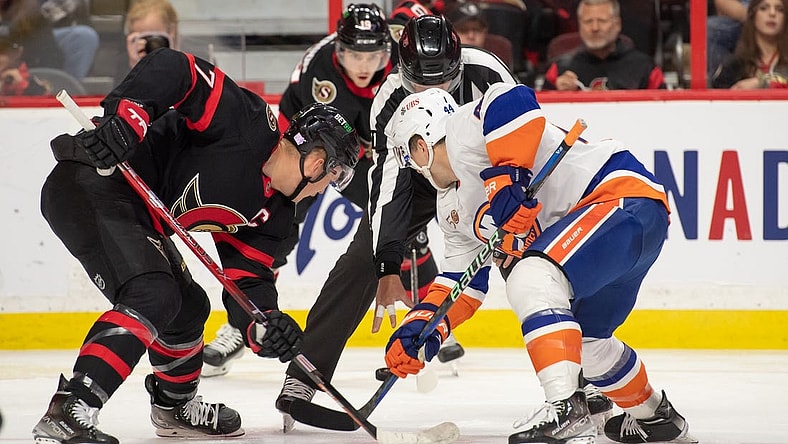 Nov 14, 2022; Ottawa, Ontario, CAN; Ottawa Senators left wing Brady Tkachuk (7) faces off against New York Islanders center Jean-Gabriel Pageau (44) in the second period at the Canadian Tire Centre. Mandatory Credit: Marc DesRosiers-USA TODAY Sports