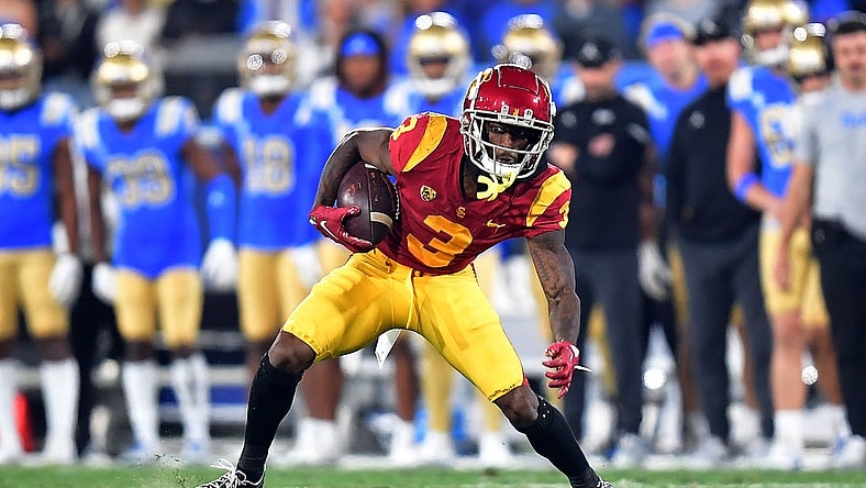 Nov 19, 2022; Pasadena, California, USA; Southern California Trojans wide receiver Jordan Addison (3) runs the ball against the UCLA Bruins during the first half at the Rose Bowl. Mandatory Credit: Gary A. Vasquez-USA TODAY Sports
