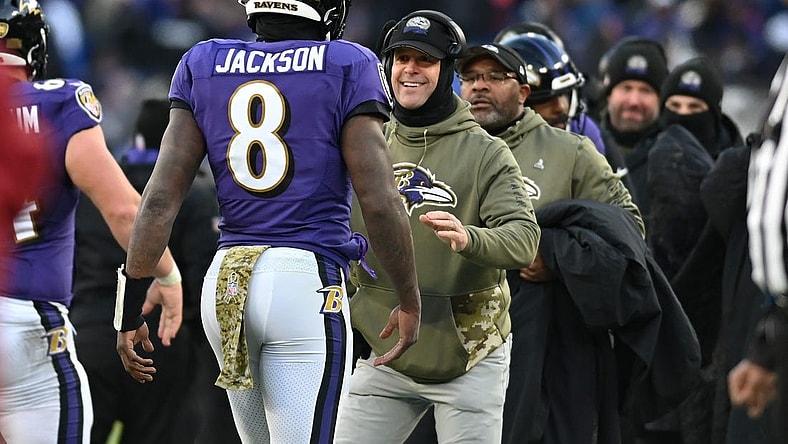 Nov 20, 2022; Baltimore, Maryland, USA;  Baltimore Ravens head coach John Harbaugh greets quarterback Lamar Jackson (8) after scoring a second half touchdown against the Carolina Panthers  at M&T Bank Stadium. Mandatory Credit: Tommy Gilligan-USA TODAY Sports