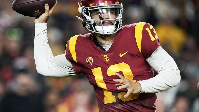 Nov 26, 2022; Los Angeles, California, USA; Southern California Trojans quarterback Caleb Williams (13)  throws the ball against the Notre Dame Fighting Irish in the first half at United Airlines Field at Los Angeles Memorial Coliseum. Mandatory Credit: Kirby Lee-USA TODAY Sports