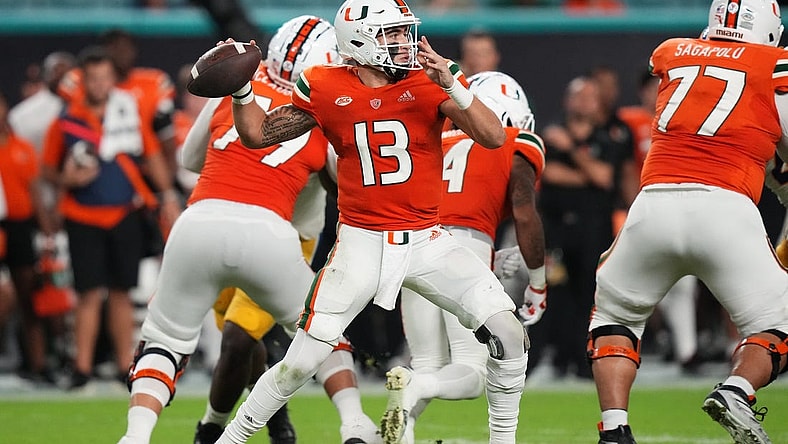 Nov 26, 2022; Miami Gardens, Florida, USA; Miami Hurricanes quarterback Jake Garcia (13) attempts a pass against the Pittsburgh Panthers during the second half at Hard Rock Stadium. Mandatory Credit: Jasen Vinlove-USA TODAY Sports