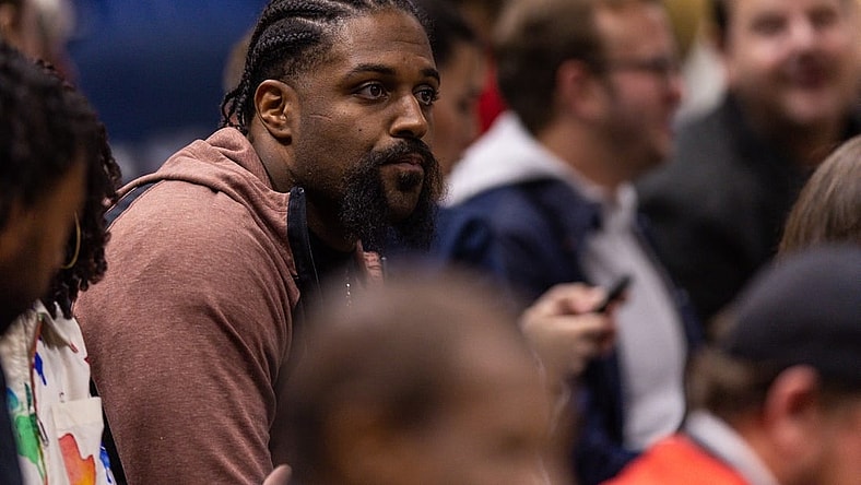 Dec 9, 2022; New Orleans, Louisiana, USA; New Orleans Saints defensive end Cam Jordan looks on at the game between the New Orleans Pelicans and the Phoenix Suns during the first half at Smoothie King Center. Mandatory Credit: Stephen Lew-USA TODAY Sports