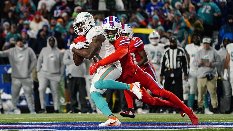 Dec 17, 2022; Orchard Park, New York, USA; Buffalo Bills safety Damar Hamlin (3) tackles Miami Dolphins running back Raheem Mostert (31) running with the ball during the first half at Highmark Stadium. Mandatory Credit: Gregory Fisher-USA TODAY Sports