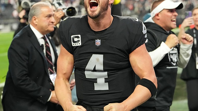 Dec 18, 2022; Paradise, Nevada, USA; Las Vegas Raiders quarterback Derek Carr (4) and Raiders head coach Josh McDaniels celebrate after the Raiders defeated the New England Patriots 30-24 at Allegiant Stadium. Mandatory Credit: Stephen R. Sylvanie-USA TODAY Sports