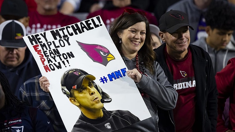 Dec 12, 2022; Glendale, Arizona, USA; An Arizona Cardinals fan in the crowd holds a sign for Sean Payton during the game against the New England Patriots at State Farm Stadium. Mandatory Credit: Mark J. Rebilas-USA TODAY Sports
