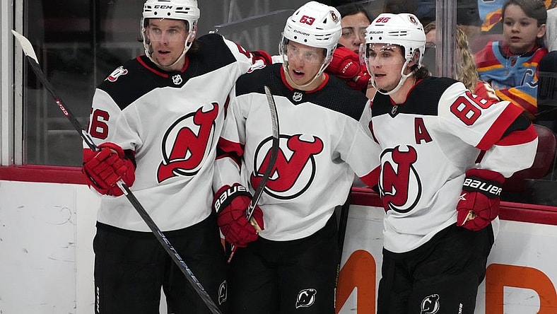 Dec 21, 2022; Sunrise, Florida, USA; New Jersey Devils left wing Jesper Bratt (63) celebrates his goal against the Florida Panthers with teammates on the ice during the third period at FLA Live Arena. Mandatory Credit: Jasen Vinlove-USA TODAY Sports