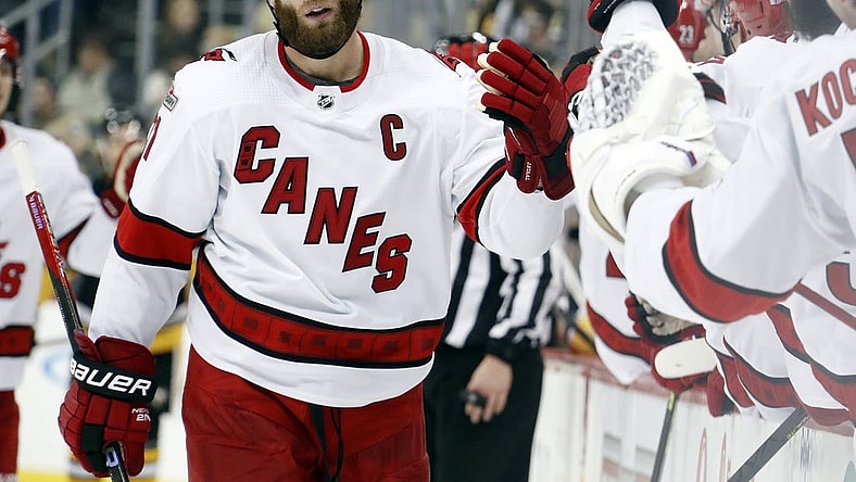 Dec 22, 2022; Pittsburgh, Pennsylvania, USA; Carolina Hurricanes center Jordan Staal (11) celebrates with the Carolina bench after scoring a goal against the Pittsburgh Penguins during the third period at PPG Paints Arena. Carolina won 4-3 in overtime. Mandatory Credit: Charles LeClaire-USA TODAY Sports