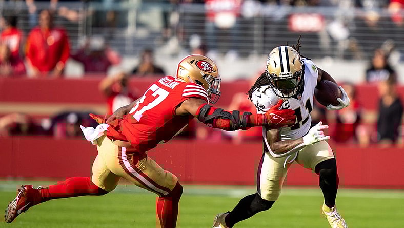 November 27, 2022; Santa Clara, California, USA; New Orleans Saints running back Alvin Kamara (41) runs the football against San Francisco 49ers linebacker Dre Greenlaw (57) during the second quarter at Levi's Stadium. Mandatory Credit: Kyle Terada-USA TODAY Sports