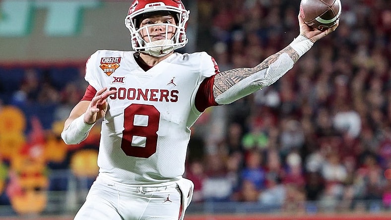 Dec 29, 2022; Orlando, Florida, USA; Oklahoma Sooners quarterback Dillon Gabriel (8) throws a pass against the Florida State Seminoles in the fourth quarter during the 2022 Cheez-It Bowl at Camping World Stadium. Mandatory Credit: Nathan Ray Seebeck-USA TODAY Sports
