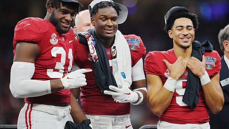 Dec 31, 2022; New Orleans, LA, USA; Alabama Crimson Tide linebacker Will Anderson Jr. (31) defensive back Jordan Battle (9) and quarterback Bryce Young (9) celebrate the victory against the Kansas State Wildcats in the 2022 Sugar Bowl at Caesars Superdome. Mandatory Credit: Andrew Wevers-USA TODAY Sports