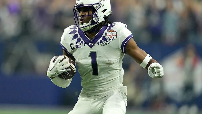 Dec 31, 2022; Glendale, Arizona, USA; TCU Horned Frogs wide receiver Quentin Johnston (1) runs after a catch in the second quarter against the Michigan Wolverines of the 2022 Fiesta Bowl at State Farm Stadium. Mandatory Credit: Kirby Lee-USA TODAY Sports