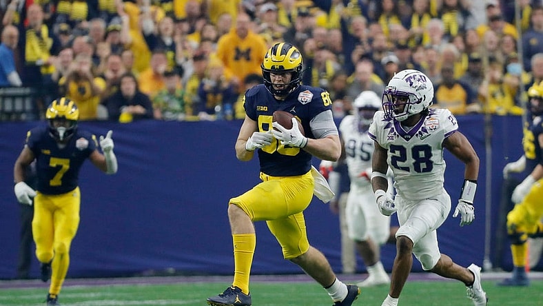 Michigan tight end Luke Schoonmaker (86) runs after a reception while TCU safety Millard Bradford (28) chases during the first quarter of the Fiesta Bowl on Saturday, Dec. 31 at State Farm Stadium in Glendale, Ariz.

2022-12-31-michigan-fiesta