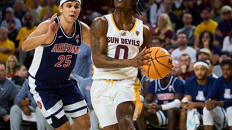 Dec 31, 2022; Tempe, Arizona, USA; Arizona State Sun Devils guard DJ Horne (0) drives for the basket as Arizona Wildcats guard Kerr Kriisa (25) pursues at Desert Financial Arena on Saturday, Dec. 31, 2022. Mandatory Credit: Alex Gould/The Republic

Basketball Asu Ua Men Bb Arizona At Arizona State