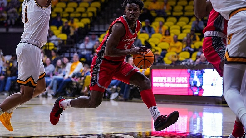 Dec 31, 2022; Laramie, Wyoming, USA; New Mexico Lobos guard Jamal Mashburn Jr. (5) drives against the Wyoming Cowboys during the first half at Arena-Auditorium. Mandatory Credit: Troy Babbitt-USA TODAY Sports