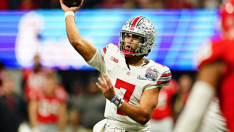 Dec 31, 2022; Atlanta, Georgia, USA; Ohio State Buckeyes quarterback C.J. Stroud (7) passes the ball against the Georgia Bulldogs during the third quarter of the 2022 Peach Bowl at Mercedes-Benz Stadium. Mandatory Credit: John David Mercer-USA TODAY Sports