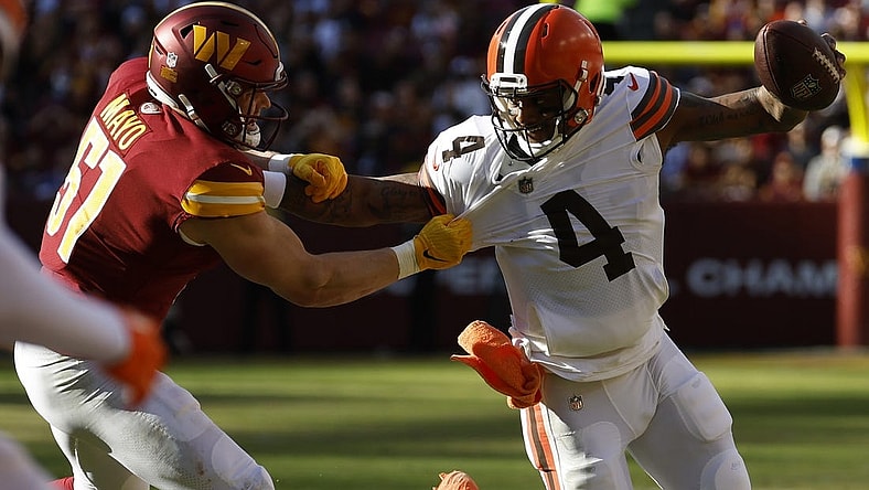Jan 1, 2023; Landover, Maryland, USA; Cleveland Browns quarterback Deshaun Watson (4) scrambles from Washington Commanders linebacker David Mayo (51) during the first quarter at FedExField. Mandatory Credit: Geoff Burke-USA TODAY Sports