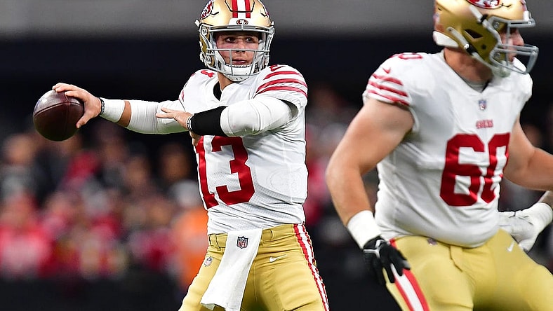 January 1, 2023; Paradise, Nevada, USA; San Francisco 49ers quarterback Brock Purdy (13) throws as offensive tackle Daniel Brunskill (60) provides coverage against the Las Vegas Raiders during the first half at Allegiant Stadium. Mandatory Credit: Gary A. Vasquez-USA TODAY Sports