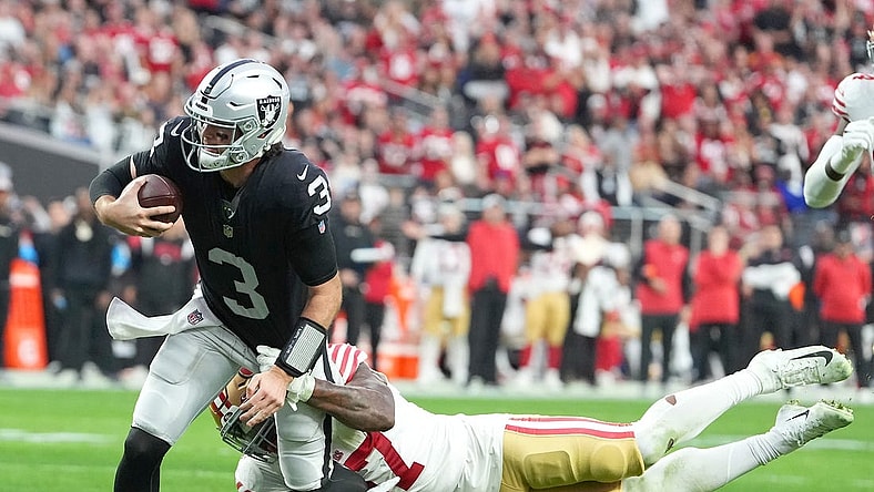 Jan 1, 2023; Paradise, Nevada, USA; San Francisco 49ers linebacker Dre Greenlaw (57) tackles Las Vegas Raiders quarterback Jarrett Stidham (3) during the first half at Allegiant Stadium. Mandatory Credit: Stephen R. Sylvanie-USA TODAY Sports