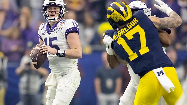 Dec 31, 2022; Glendale, Arizona, USA; TCU Horned Frogs quarterback Max Duggan (15) against the Michigan Wolverines during the 2022 Fiesta Bowl at State Farm Stadium. Mandatory Credit: Mark J. Rebilas-USA TODAY Sports