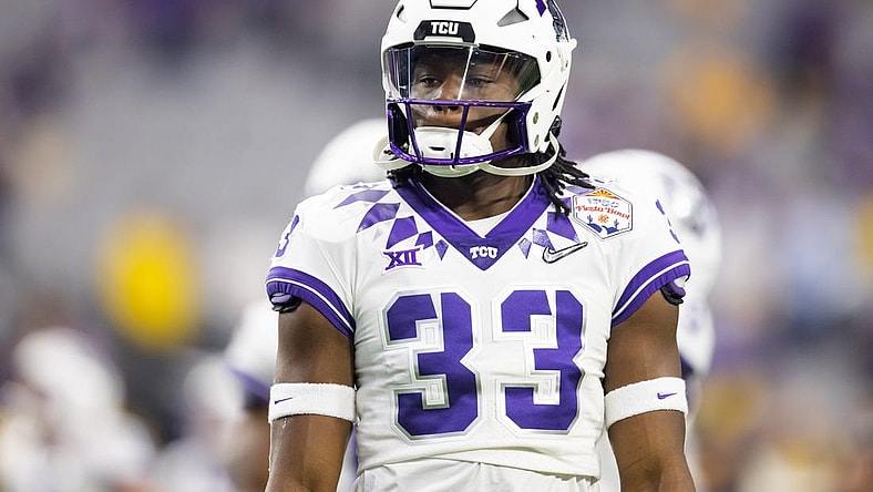 Dec 31, 2022; Glendale, Arizona, USA; TCU Horned Frogs running back Kendre Miller (33) against the Michigan Wolverines during the 2022 Fiesta Bowl at State Farm Stadium. Mandatory Credit: Mark J. Rebilas-USA TODAY Sports