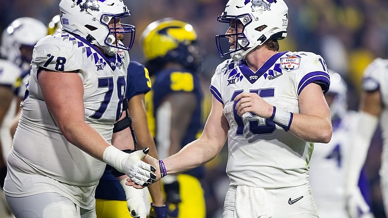 Dec 31, 2022; Glendale, Arizona, USA; TCU Horned Frogs offensive lineman Wes Harris (78) celebrates a touchdown with quarterback Max Duggan (15) against the Michigan Wolverines during the 2022 Fiesta Bowl at State Farm Stadium. Mandatory Credit: Mark J. Rebilas-USA TODAY Sports