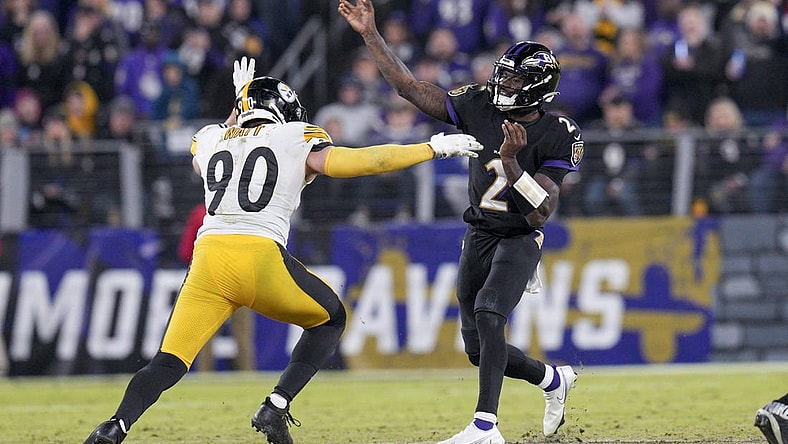 Jan 1, 2023; Baltimore, Maryland, USA; Baltimore Ravens quarterback Tyler Huntley (2) throws a pass against Pittsburgh Steelers linebacker T.J. Watt (90) during the second half at M&T Bank Stadium. Mandatory Credit: Jessica Rapfogel-USA TODAY Sports