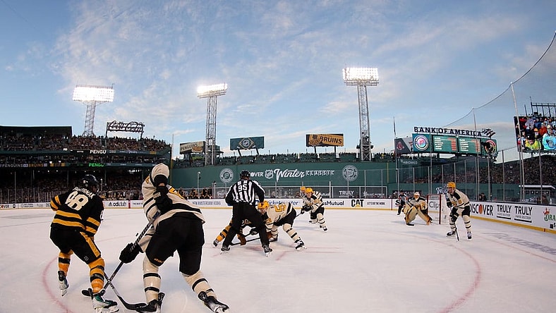Jan 2, 2023; Boston, Massachusetts, USA; A face-off between the Boston Bruins and the Pittsburgh Penguins during the second period of the 2023 Winter Classic ice hockey game at Fenway Park. Mandatory Credit: Paul Rutherford-USA TODAY Sports