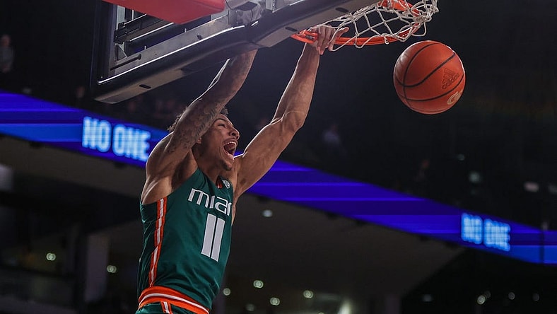 Jan 4, 2023; Atlanta, Georgia, USA; Miami Hurricanes guard Jordan Miller (11) dunks against the Georgia Tech Yellow Jackets in the first half at McCamish Pavilion. Mandatory Credit: Brett Davis-USA TODAY Sports
