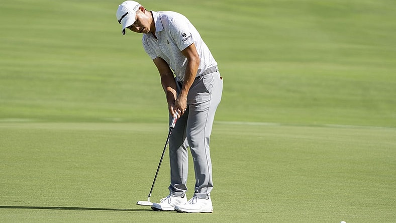January 5, 2023; Maui, Hawaii, USA; Collin Morikawa putts on the 18th hole during the first round of the Sentry Tournament of Champions golf tournament at Kapalua Resort - The Plantation Course. Mandatory Credit: Kyle Terada-USA TODAY Sports