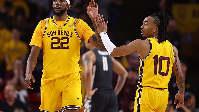 Jan 5, 2023; Tempe, Arizona, USA; Arizona State Sun Devils forward Warren Washington (22) celebrates with guard Frankie Collins (10) against the Washington State Cougars in the second half at Desert Financial Arena. Mandatory Credit: Mark J. Rebilas-USA TODAY Sports