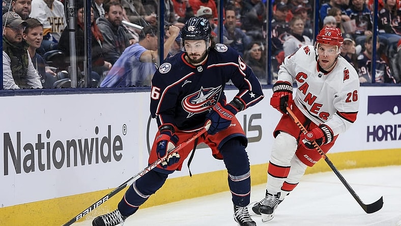 Jan 7, 2023; Columbus, Ohio, USA;  Columbus Blue Jackets right wing Kirill Marchenko (86) controls the puck against Carolina Hurricanes center Paul Stastny (26) in the second period at Nationwide Arena. Mandatory Credit: Aaron Doster-USA TODAY Sports