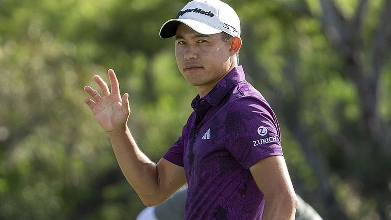 January 7, 2023; Maui, Hawaii, USA; Collin Morikawa acknowledges the crowd after making his putt on the 18th hole during the third round of the Sentry Tournament of Champions golf tournament at Kapalua Resort - The Plantation Course. Mandatory Credit: Kyle Terada-USA TODAY Sports