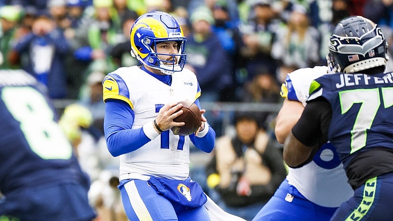 Jan 8, 2023; Seattle, Washington, USA; Los Angeles Rams quarterback Baker Mayfield (17) drops back to pass against the Seattle Seahawks during the second quarter at Lumen Field. Mandatory Credit: Joe Nicholson-USA TODAY Sports