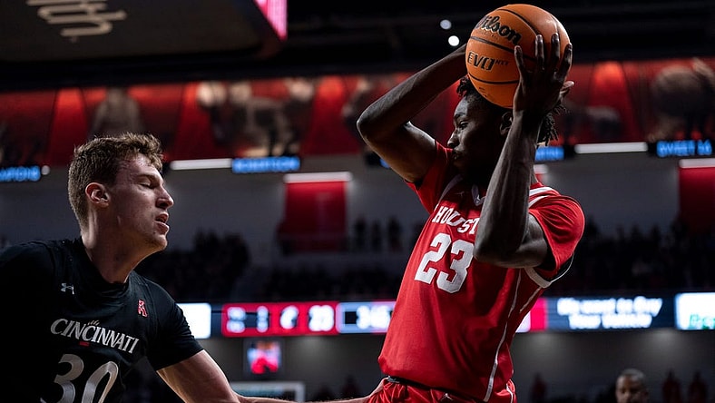 Houston Cougars guard Terrance Arceneaux (23) controls the ball as Cincinnati Bearcats forward Viktor Lakhin (30) guards him in the first half of the NCAA men   s basketball game at Fifth Third Arena in Cincinnati on Sunday, Jan. 8, 2023.

Ncaa Basketball Houston Cougars At Cincinnati Bearcats