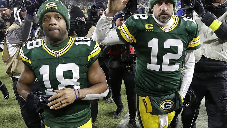 Jan 8, 2023; Green Bay, Wisconsin, USA; Green Bay Packers wide receiver Randall Cobb (18) and quarterback Aaron Rodgers (12) leave the field together after losing to the Detroit Lions at Lambeau Field. Mandatory Credit: Dan Powers/Appleton Post-Crescent via USA TODAY NETWORK
