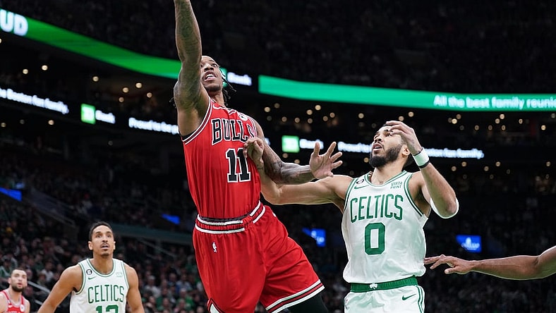 Jan 9, 2023; Boston, Massachusetts, USA; Chicago Bulls forward DeMar DeRozan (11) drives to the basket against Boston Celtics forward Jayson Tatum (0) in the first quarter at TD Garden. Mandatory Credit: David Butler II-USA TODAY Sports